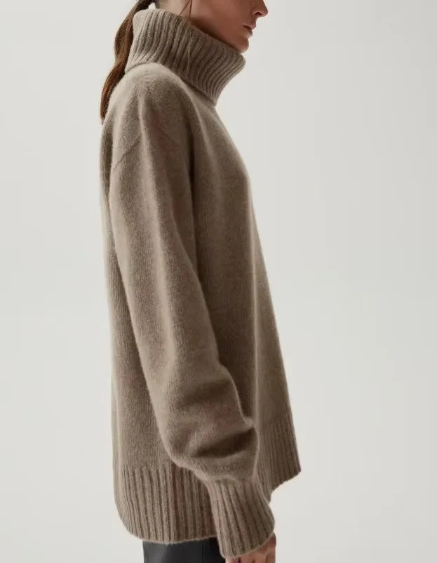 Side view of the taupe Mabel turtleneck showing the oversized fit and longer length