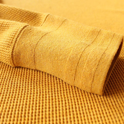 Ribbed cuff on the Harlow Waffle Henley in mustard